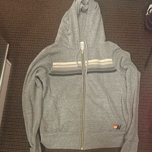 Aviator nation grey hoodie with different shades or stripes